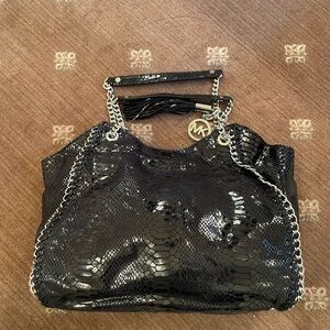Michael Kors black leather handbag.
